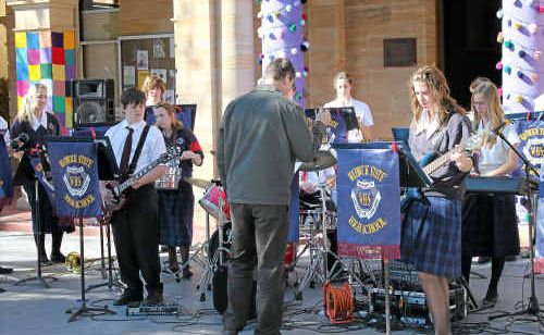 Warwick State High School students entertain in front of the Warwick Town Hall. Warwick State High School students entertain in front of the Warwick Town Hall.